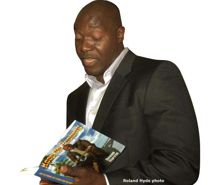 Motivational speaker author Devon Harris reading Keep On Pushing at a book signing