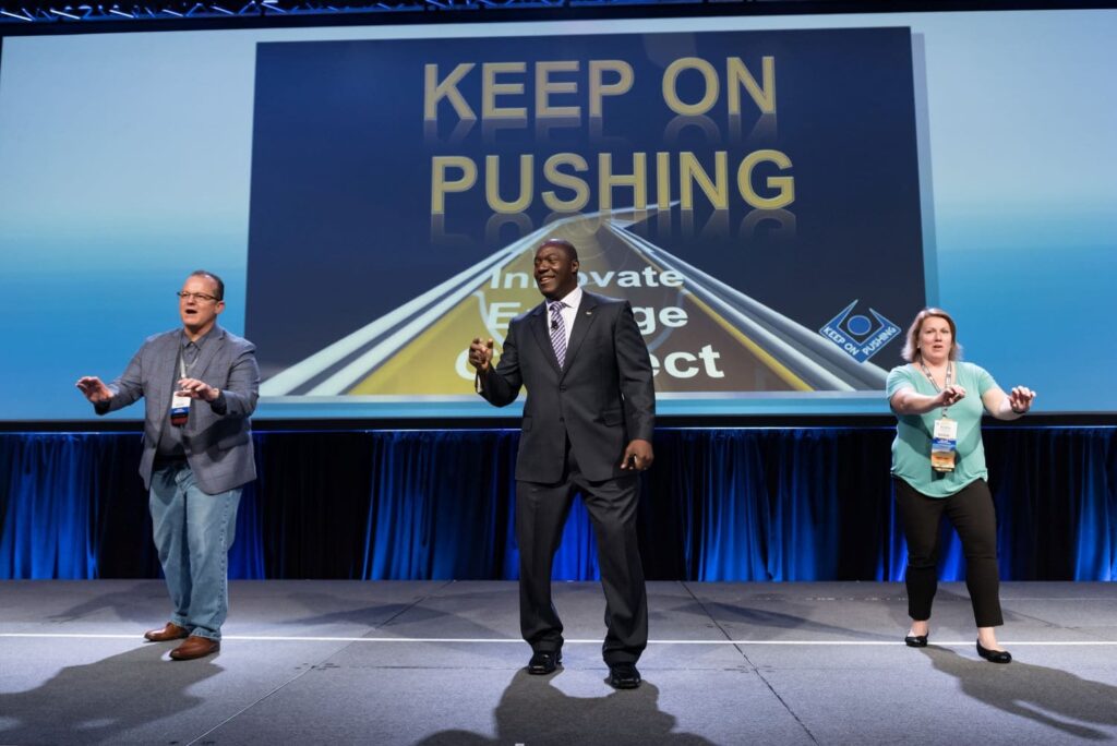 Audience engaged during a Devon Harris full-day corporate motivational seminar and leadership workshop