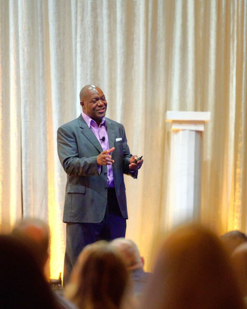 Devon Harris speaking at leadership conference