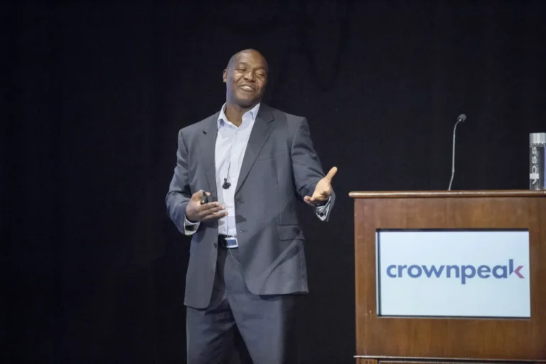 Keynote speaker Devon Harris at a leadership meeting podium