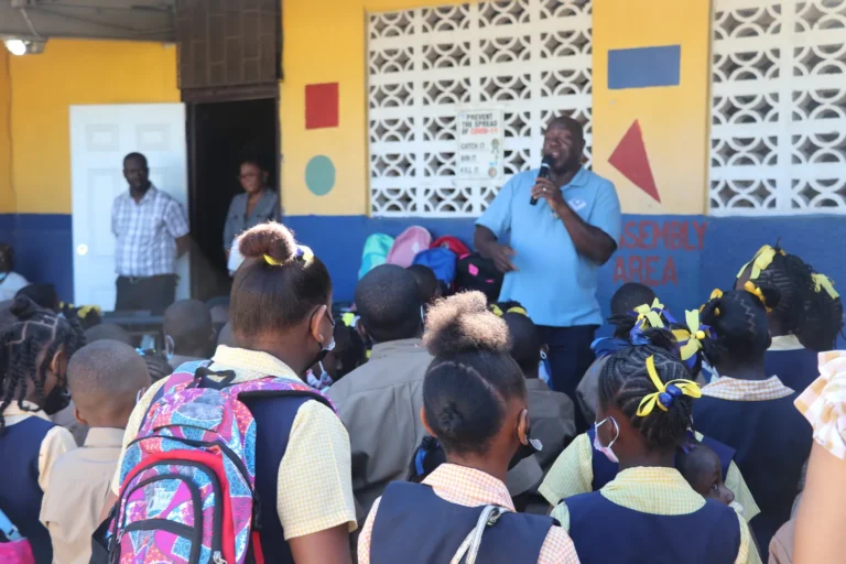 Olympian Devon Harris speaking to students at a school assembly