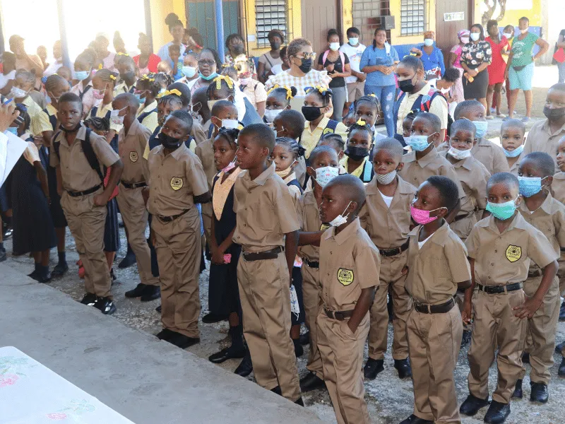Students lined up at a Keep On Pushing Foundation school supplies day in Kingston