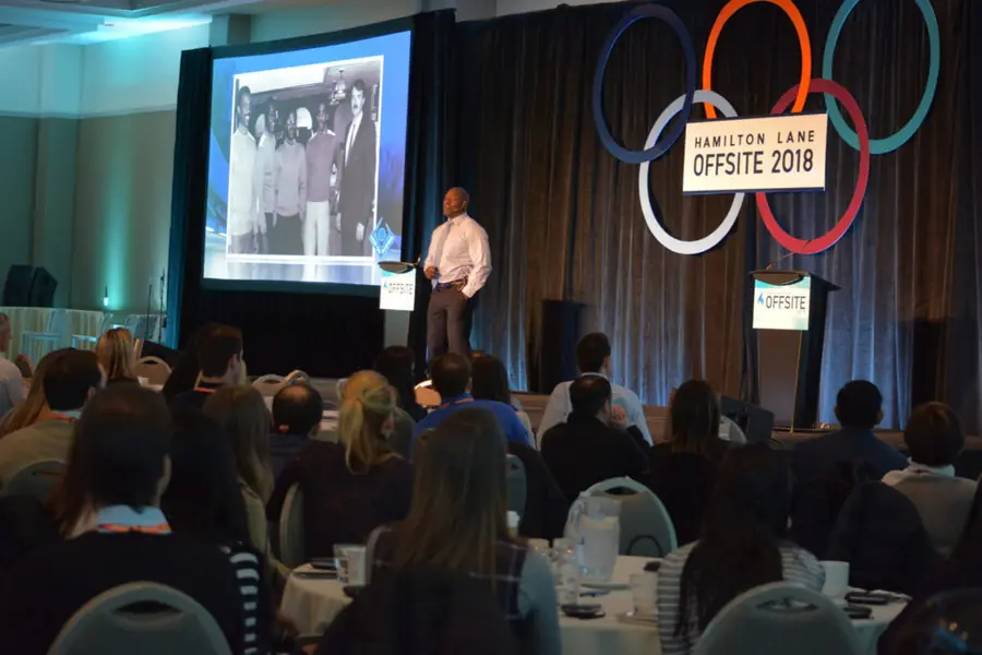 Devon Harris giving a keynote at a leadership offsite