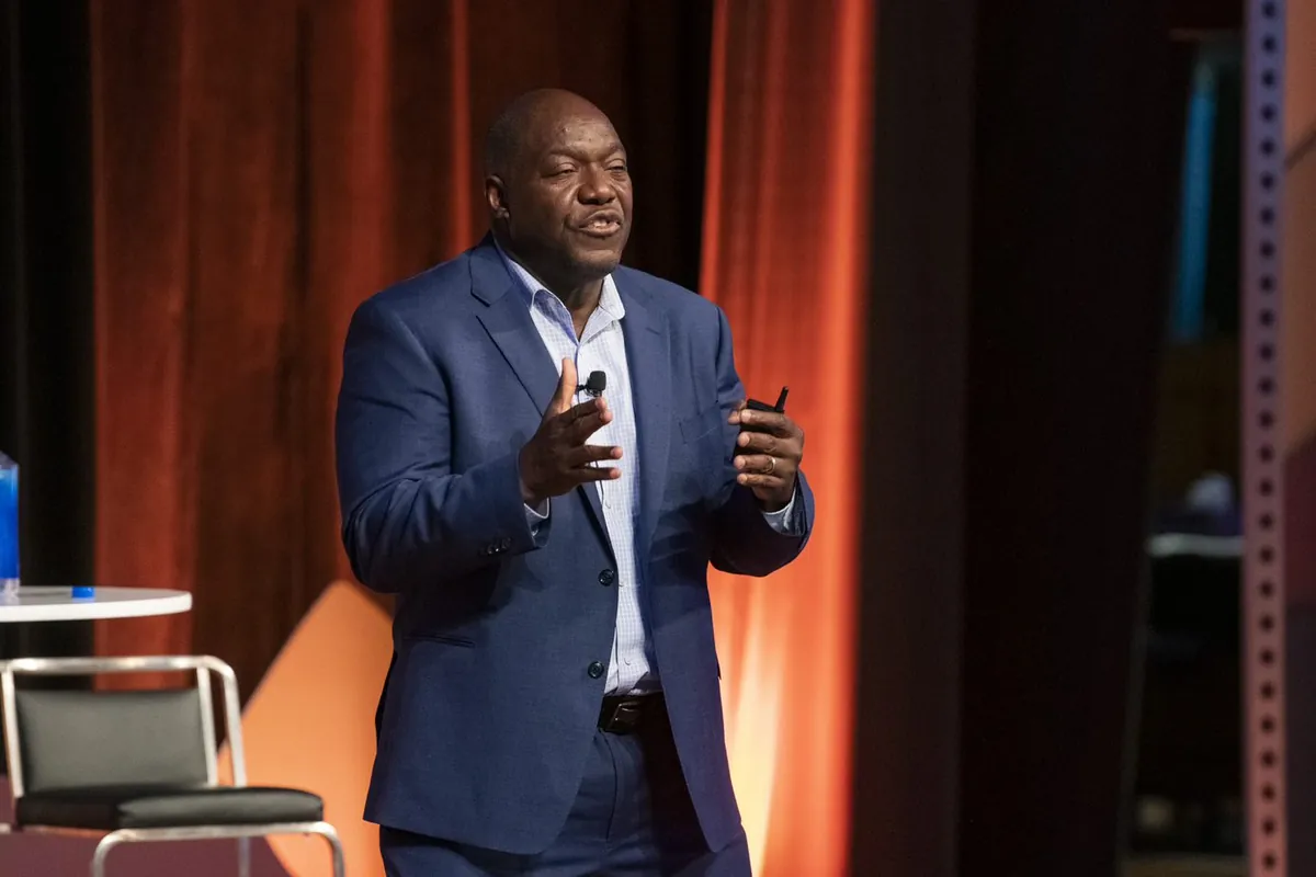 Devon Harris, author of GOALS, speaking on stage