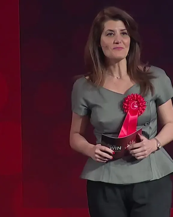 Event host on stage after Devon Harris keynote at a global sales summit